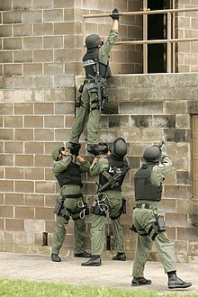 U.S. Air Force 37th Training Wing's Emergency Services Team use a team lift technique to enter a target building during training at Lackland Air Force Base, Texas on April 24, 2007. Members of the 37th Training Wing's Emergency Services Team at Lackland AFB.jpg