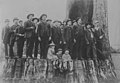 Men and children on top of a large tree stump, probably between 1880 and 1889 (PEISER 183).jpg