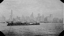 A railroad car float in the Upper New York Bay, 1919. Similar barges are still used today. NYH carfloat.jpg