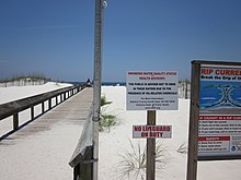 Sign in Orange Beach, Alabama advising against swimming due to the oil spill Orange Beach Do Not Swim sign walkway.JPG