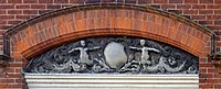 Stone relief, east side of house.