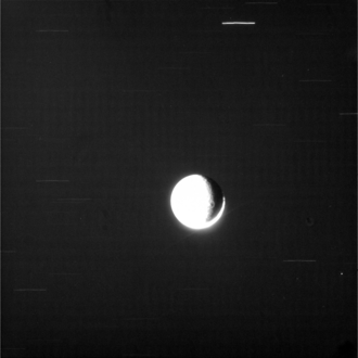 A 100 s exposure of a back-lit Rhea failed to find any evidence of rings, whether they are too tenuous or do not scatter enough light to be detected. This viewing geometry is attuned to detecting dust-sized particles, so a ring made of larger debris is possible. The sun-lit crescent is on the lower side; the gibbous illumination on the left is planetshine. Rhea N1516373983 1-RHCL1CL2.png