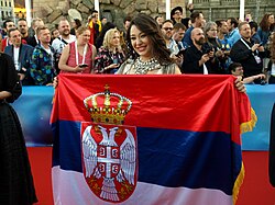 Sanja Vučić with the Serbian flag at the opening ceremony of the Eurovision Song Contest 2016