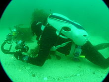 Diving with a scuba set with integral storage and transport bag. The Mini B scuba system is shown Scuba set with integral bag PA111753.JPG