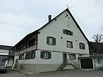 Former farmhouse with barn