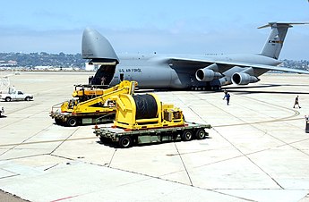 A C-5 Galaxy is loaded with people and equipment from the Deep Submergence Unit, Naval Base Coronado. The C-5 is bringing two Super Scorpio robotic rescue vehicles to Russia to assist in the rescue. Super Scorpio C-5 Loading.jpg