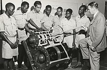 A European instructor lectures African students on the functioning of a steam engine in East Africa, c.1950 The National Archives UK - CO 1069-130-21.jpg
