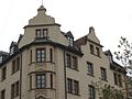 Theresienstraße 93; Mietshaus, stattlicher Eckbau in deutscher Renaissance, mit plastischem Dekor an den Erkern, bez. 1897; am Westrand des Massmannplatzes. This is a picture of the Bavarian Baudenkmal (cultural heritage monument) with the ID D-1-62-000-6872 (Wikidata)