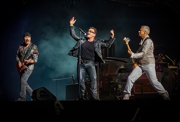 U2 performing in 2010 on the U2 360° Tour. The tour was one of several commitments which limited the group's ability to complete a follow-up to No Lin