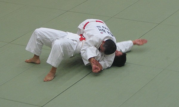 An Americana armlock submission from traditional side control.