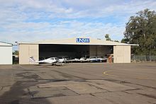 UNSW School of Aviation hangar at Bankstown Airport, with some of the school's training aircraft University of NSW flight training hangar.JPG