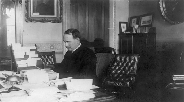 Secretary of the Navy William C. Whitney in his office (circa 1885)