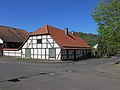 Elongated half-timbered house - low post construction