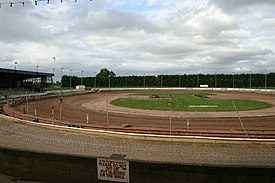 A dirt oval track used for stock car racing and Banger racing - Mildenhall Stadium, Suffolk, England (2006) West row stadium.jpg