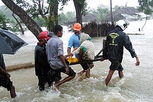 Woman in Sri Lanka rescued during monsoon flooding.jpg