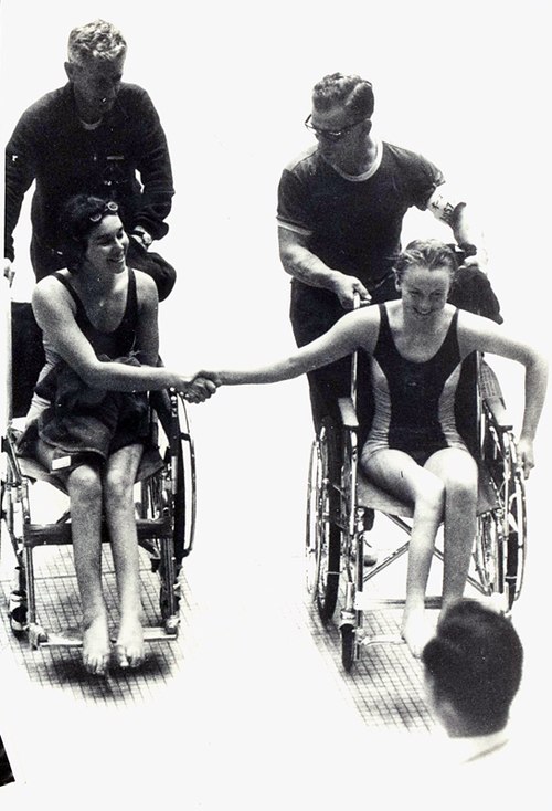 Daphne Ceeney and Elizabeth Edmondson shake hands after Edmondson won gold and Ceeney silver in the 50 m prone swimming event in Tokyo at the 1964 Sum