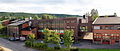 Skolens bygninger ligger langs Karl Fossums vei, med verkstedshallene til TIP til høyre Foto: C. Hill, 2012