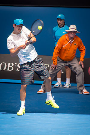 Tomic playing a shot