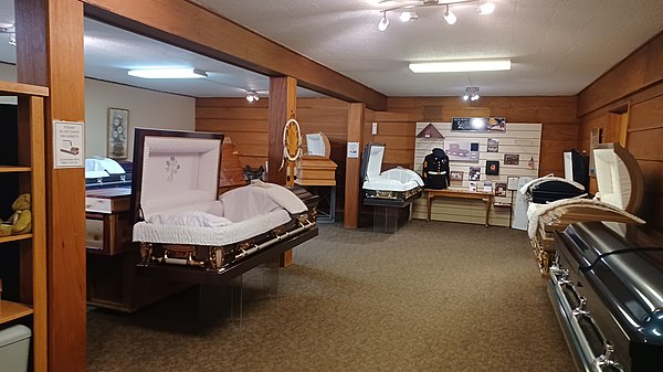 A casket showroom in Billings, Montana, depicting split lid coffins.