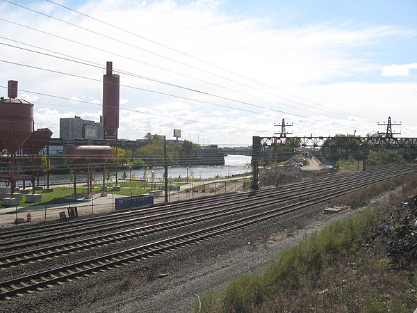 A rail line runs along the river