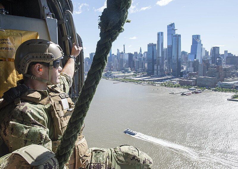 File:An EODMU 6 technician flies along the Manhattan skyline in an MH-60S Seahawk assigned to HSC-9 during Fleet Week New York 2019.jpg