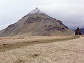 The volcano Stapafell with the sculpture of Bárður by Ragnar Kjartansson