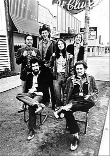 Mid-70s Western-inspired outifts worn by country music group Asleep at the Wheel. Asleep at the Wheel 1976.JPG