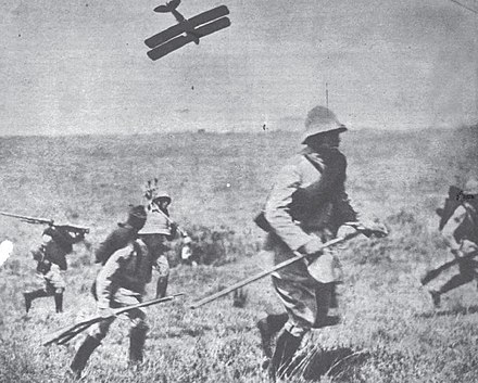 Rebel infantry advancing under air attack by a Waco CSO (or Potez 25) airplane of the Brazilian government during the Constitutionalist Revolution of 1932