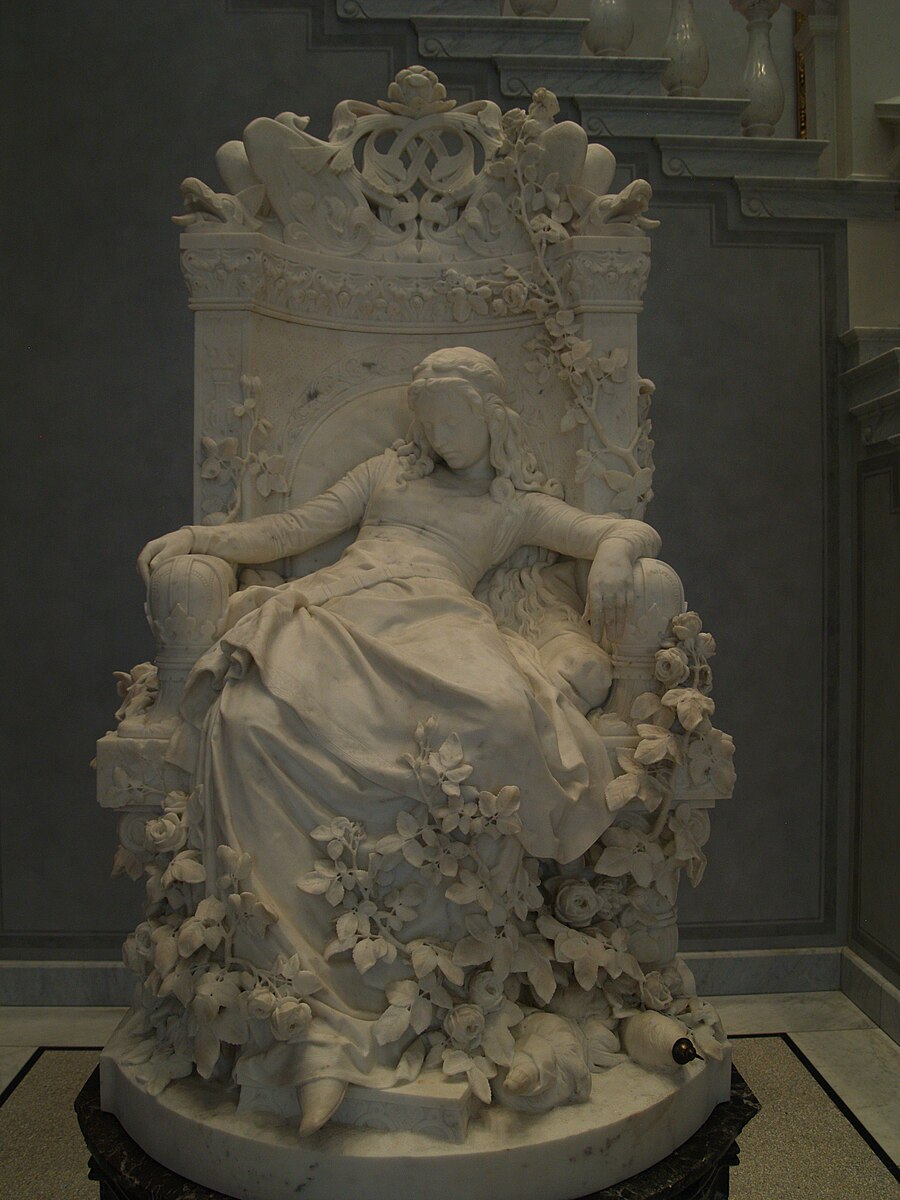Escultura de Louis Sussmann-Hellborn. En esta escultura aparece Talía, la bella durmiente.