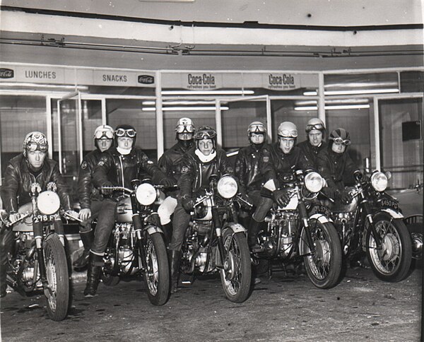 1960s Rockers under canopy outside Busy Bee Café, Watford, England