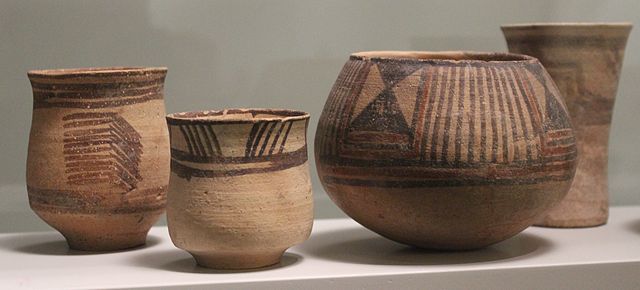 Ceramic from Period III (third vessel from the left), and from Period IV