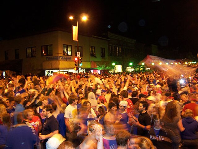 KU fans celebrating in downtown Lawrence after KU's win over Memphis