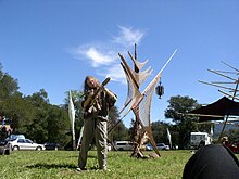 Musicians intermingled with sculptured art installations. ChileanChirangoPlayerChris GeofBardPhoto CCA3 Wikicommons.jpg