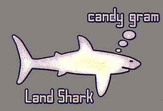 Image of a Land Shark from Saturday Night Live inside an Analog Devices AD1939 codec chip. ChipWorksLandShark.jpg