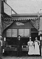 DW Alexander, a woman identified as Lizzie Alexander, and two unidentified men in front of Alexander's Oyster House, Bellingham (WASTATE 3148).jpeg