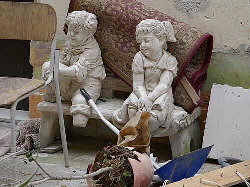 two stone sculptures in a backyard in Palermo