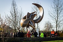 The sculpture Flight in Mind by the artist Olivier Strebelle was damaged in the attacks. After some months of restoration, the sculpture was relocated to an outdoor area of the airport. It is seen here on the 1st anniversary of the attacks. Flight in Mind (1).jpg