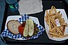 Hamburger on gluten-free bun, with pickles, jalepeño, and roasted red pepper, at Smokejumpers Grill