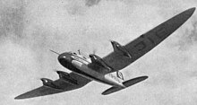 V2 Schlesien D-JAIE, in flight Heinkel He 116 photo L'Aerophile October 1937.jpg