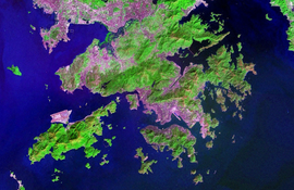 Land reclamation (grey area) in Hong Kong. Note that most of the urban area (shown in pink in the map below) of Hong Kong is on the reclaimed land.