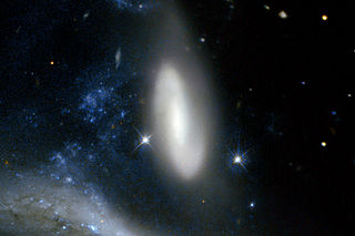 <span class="mw-page-title-main">IC 4970</span> Lenticular galaxy interacting with NGC 6872 in the constellation Pavo.