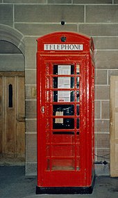 A K6 telephone box, also designed by Sir Giles Gilbert Scott, in the cathedral K6PhoneBox.jpg