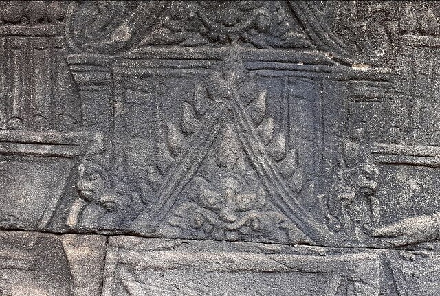 Triangular gabled roof depicted on a Bayon's 12th century bas relief still used in today Khmer architecture for palaces and pagodas.