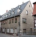 Residential house in closed development and two rear buildings