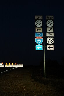 Early morning shot of the current western terminus of MS 76 MS76wEndRoad-MS23ns-ToUS78Int22signs (24140408157).jpg