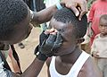 Make-Up Artist Preparing an Atilogu Dancer - Igbo Tribe - Oji River - Enugu State - Nigeria.jpg