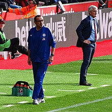 Hughes (right) managing Southampton in 2018 Maurizio Sarri Mark Hughes.jpg