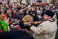 Musicians with Ukrainian folk instruments perform carols at Lviv's Christmas Parade of Star-bearers among a sea of people