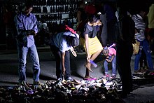 Nightly street sales of used clothing in Tanzania in 2017