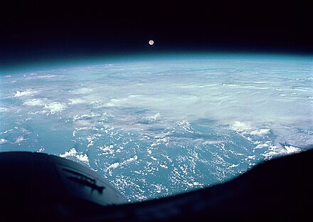 Moon and clouds over the Western Pacific as seen from Gemini 7